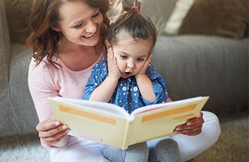 Mother reading to toddler