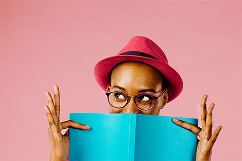 woman looking over a book