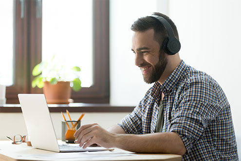 adult man on a laptop