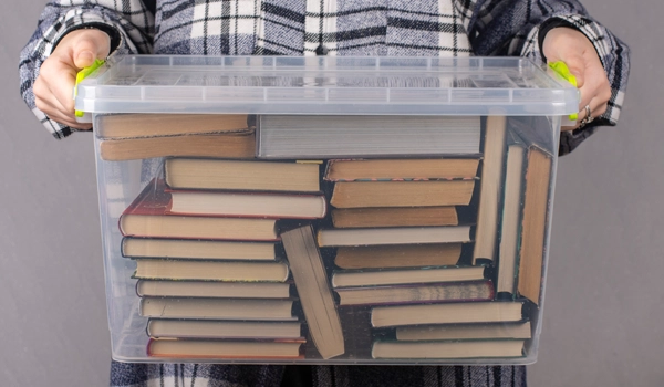 Books in a plastic tote