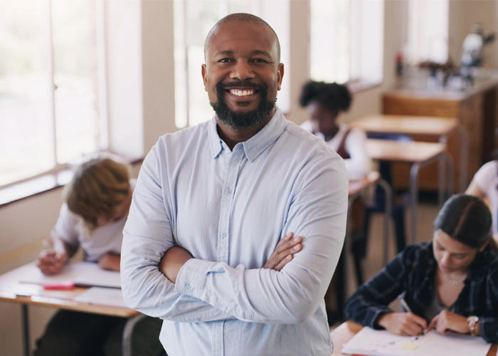 male teacher in classroom of students