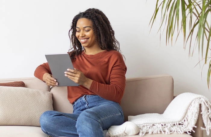 woman reading her tablet