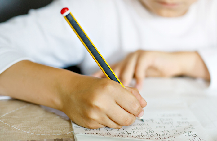 hands writing a story