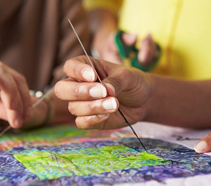 hand holding brush being creative