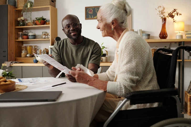 young man discussing options with an elderly woman
